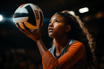 Portrait of a young female volleyball player in action during a match - obrazy, fototapety, plakaty