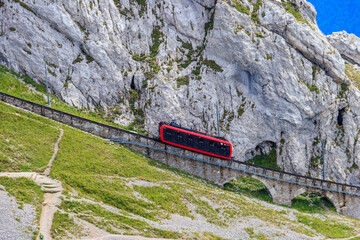 Cogwheel train climbing to the top of Mount Pilatus in Canton Lucerne, Switzerland. World's...
