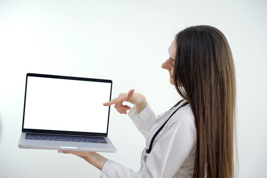 Female doctor making video call on laptop mock up screen with patient . High quality photo