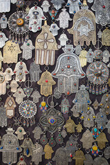 Marrakech, Morroco - Feb 10, 2023: Metal charms and pendants in the form of the Hand of Fatima