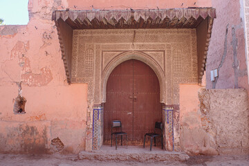 Marrakech, Morocco - Feb 24, 2023: Arched doorway entrance to a building in the Marrakech Medina
