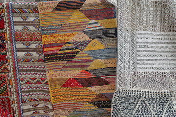 Imlil, Morocco - Fenb 22, 2023: Traditional Berber rugs and carpets on sale in the High Altas...