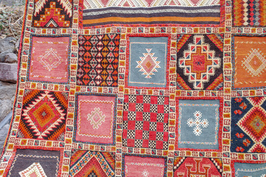 Imlil, Morocco - Fenb 22, 2023: Traditional Berber rugs and carpets on sale in the High Altas Mountains