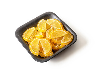 Lemon slices of marmalade, sprinkled with sugar in a brown package