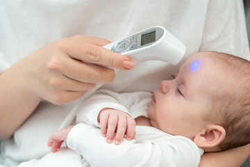 Woman's touch: digital health care for infant. Concept of evolving motherly instincts with...