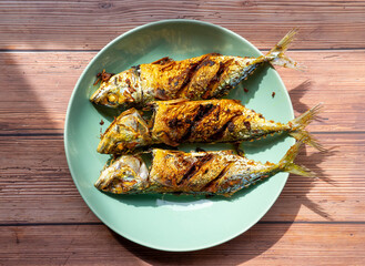 Fried mackerel with turmeric from greens