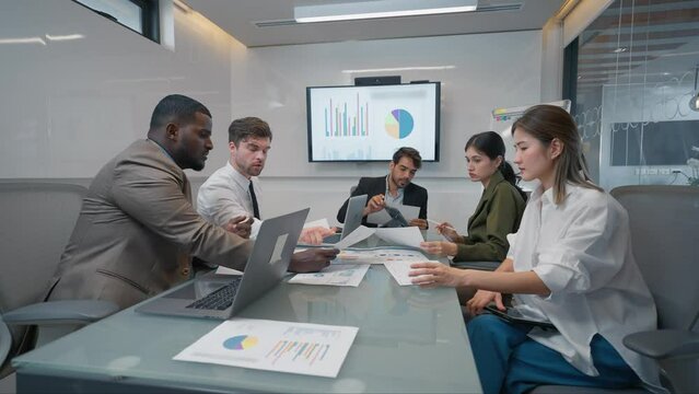 Serious team of businesspeople discussion and brainstom planning strategy corporate in meeting room. Group of businesspeople working together in boardroom at office. Business meeting concept