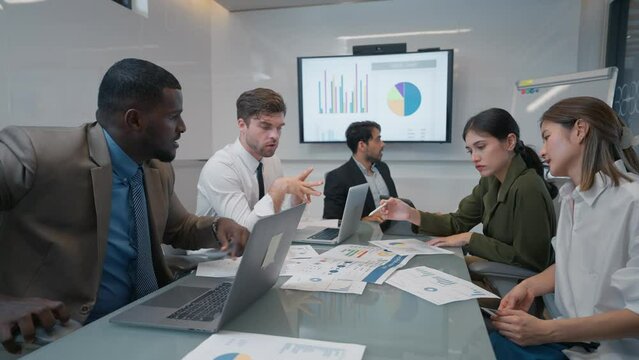 Serious team of businesspeople discussion and brainstom planning strategy corporate in meeting room. Group of businesspeople working together in boardroom at office. Business meeting concept