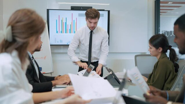 Serious team of businesspeople discussion and brainstom planning strategy corporate in meeting room. Group of businesspeople working together in boardroom at office. Business meeting concept