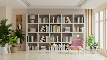 Library in the living room with pink armchair on empty dark brown color wall. © Vanitjan