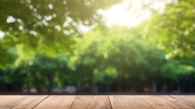 Empty wooden table for product display. Blurred green nature park background