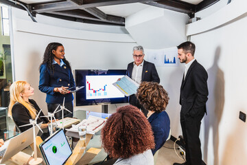 Models of wind turbines in an office of a renewable green energy start-up