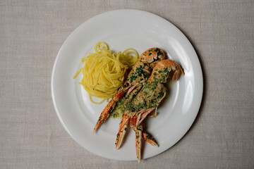 Scampi Buzara or Skampi na Buzaru King Prawns with Linguine, Garlic, Parsley and White Wine Sauce, a Typical Croatian Dish