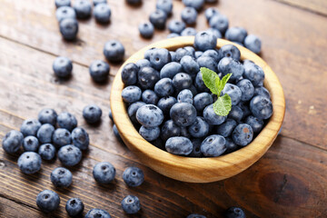 ripe organic bog whortleberry in a wooden plate