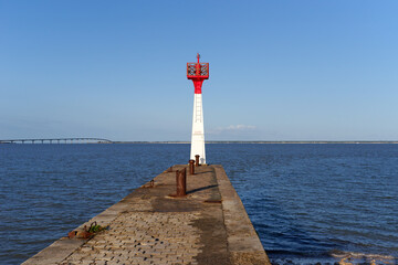 Lighthouse of the Plomb harbor and  The R&eacute; bridge in the Charente Maritime coast