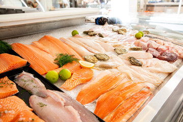 A variety of different seafood on the counter, on ice, at the fish market in Finland