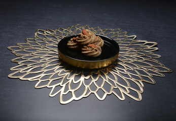 handmade baked luxury crispy traditional western earl grey tea butter coffee quqi almond cookies in gold plate fork knife on dark background pastry dessert halal festive biscuit vegan menu for cafe