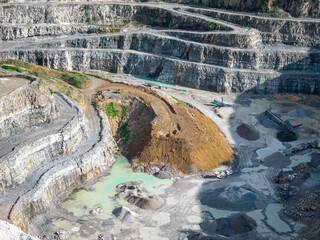 Opencast Mine Aerial View. Industrial terraces in a mining quarry. Open pit mining of dolomite....