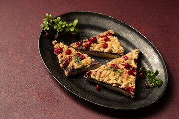 delicious crumble with lingonberry jam on a vintage tray
