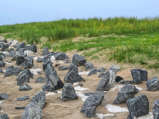 Island of Norderney in Germany - rocks on sand