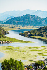 Panoramic view of Rijeka Crnojevica river, Skadar lake location. Attractive summer scene of Karuc village, Montenegro, Europe