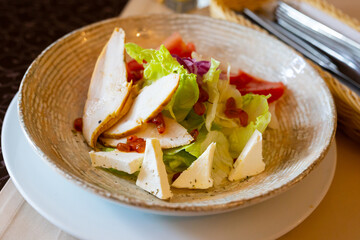 Caesar salad with chicken and dehydrated sea buckthorn
