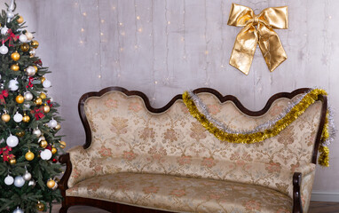 Lnterior with decorated christmas tree and sofa in studio