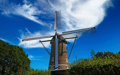 Venray, Netherlands (Limburg) - July 9. 2023: Old dutch Sint Petrus wind mill in rural town