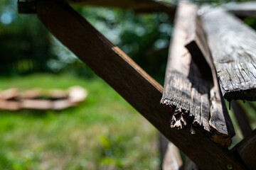 Broken, rotten pine wood table close up shot , space for text.