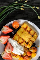 Tropical Temptation: 4K Close-Up of Delicious Grilled Pineapple with Yogurt and Strawberry