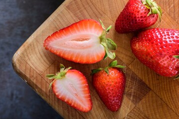 Berry Medley: 4K Top-Down View of Fresh Strawberries and Berries on a Wooden Surface