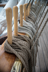 Ship ropes are laid on the rigging of the deck of a sailing ship