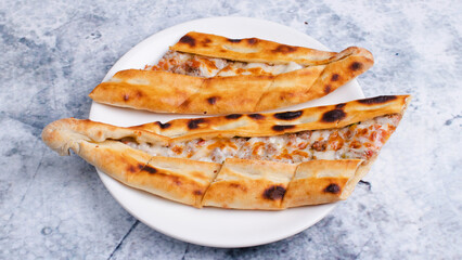Turkish cheese pide top view isolated
