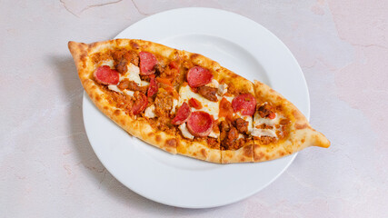 Turkish sausage pide top view isolated