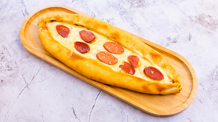 Turkish sausage pide top view isolated