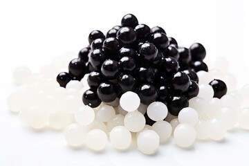 White background with copy space, depicting boiled tapioca pearls used for bubble tea, often referred to as black pearls.