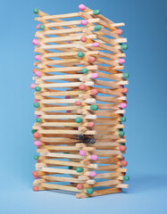 tower of colorful matches with burnt matches