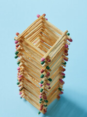 a tower built of multi-colored matches