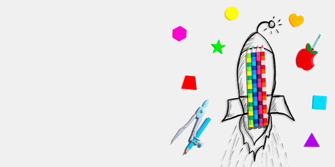 Back to school theme with a rocket with school supplies - Flat lay