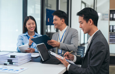 Asian business people teamwork strategy corporate meeting in progress, brainstorming ideas, leadership decision-making executives in conference boardroom, productive people engaged in problem-solving