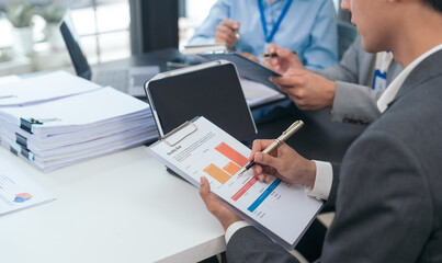 Asian business people teamwork strategy corporate meeting in progress, brainstorming ideas, leadership decision-making executives in conference boardroom, productive people engaged in problem-solving