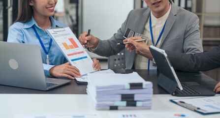 Asian business people teamwork strategy corporate meeting in progress, brainstorming ideas, leadership decision-making executives in conference boardroom, productive people engaged in problem-solving