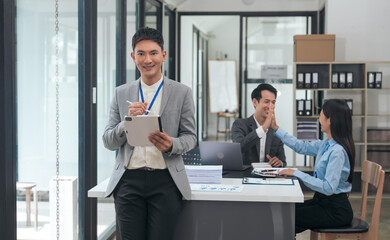 Asian business people teamwork strategy corporate meeting in progress, brainstorming ideas, leadership decision-making executives in conference boardroom, productive people engaged in problem-solving