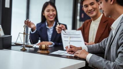 Fototapeta premium Signing contract, Legal consultation, asian lawyers team meeting, contract finalization, lawyers discussing agreements, contract review session, agreement assessment, legal experts in conversation