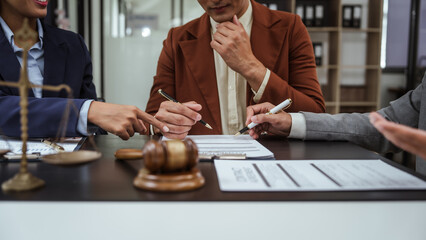 Legal consultation, asian lawyers team meeting post-contract, contract finalization, lawyers discussing agreements, contract review session, agreement assessment, legal experts in conversation