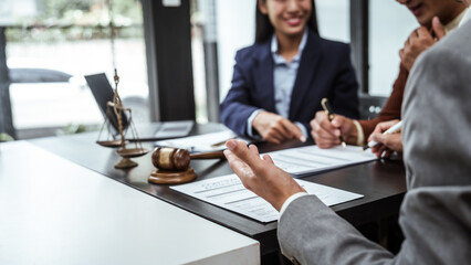 Legal consultation, asian lawyers team meeting post-contract, contract finalization, lawyers discussing agreements, contract review session, agreement assessment, legal experts in conversation