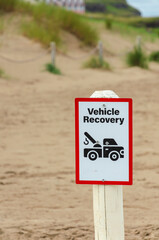 Vehicle Recovery sign on beach