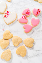 Obraz na płótnie Canvas Heart-shaped sugar cookies with royal icing