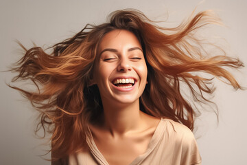 Charming Asian teenager with wavy long hair blowing in the breeze exudes positivity with a bright smile on a solid background. Generative AI. - Powered by Adobe