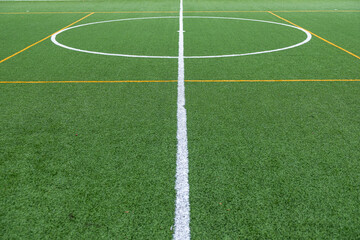 Detail of the center of an artificial grass 7-a-side football field. © VicVaz